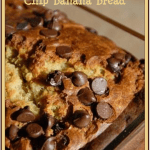 A close-up of a golden-brown loaf of peanut butter chocolate chip banana bread rests on a wooden surface, with deliciously visible chocolate chips. Text at the top offers a tempting peek into this irresistible peanut butter chocolate chip banana bread recipe.