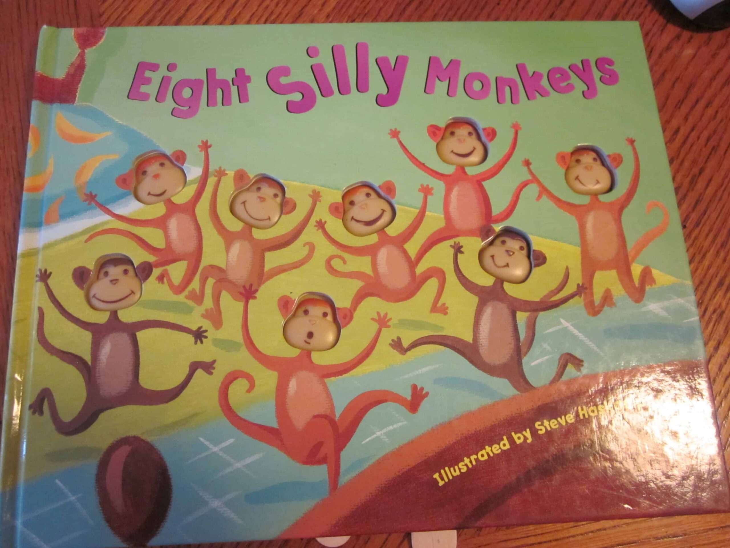 Cover of the childrens book Eight Silly Monkeys, featuring eight playful monkeys jumping and smiling on a colorful background, perfect for inspiring a fun printable craft activity.