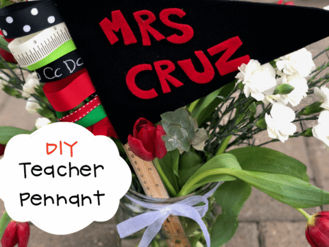 DIY teacher pennant reading “Mrs. Cruz” displayed in a jar with flowers, ribbons, and school-themed supplies.