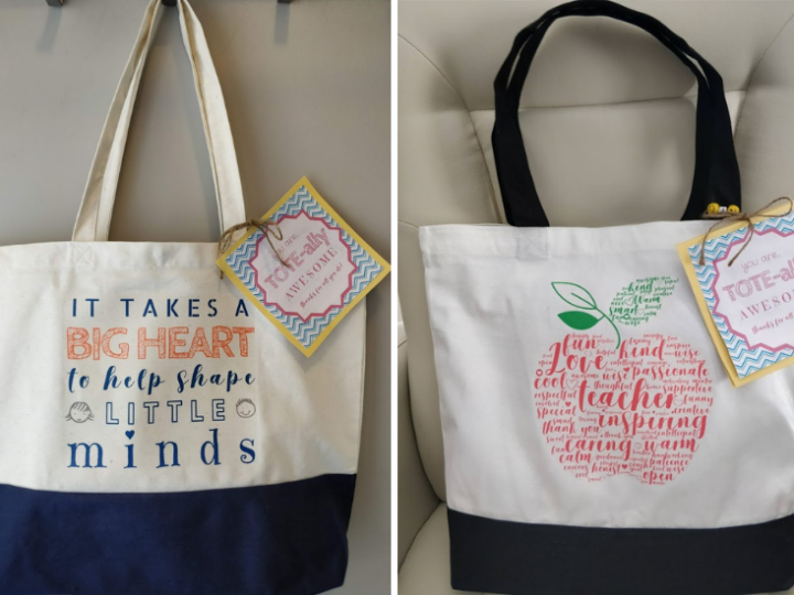 Two teacher appreciation tote bags with printed designs and gift tags, including a message about shaping young minds and an apple graphic with teacher-themed words.