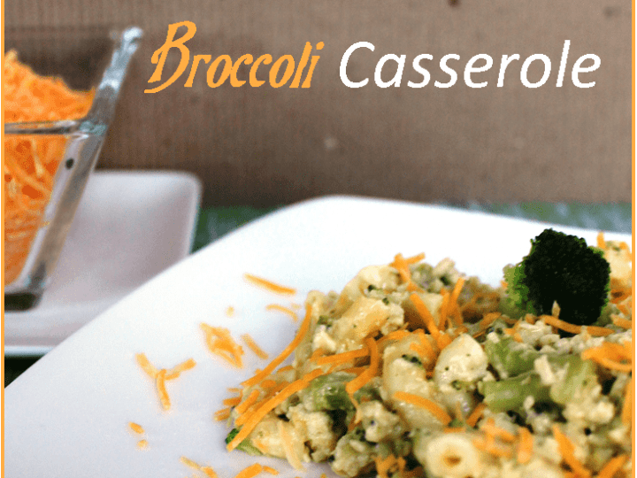 A plate of Cheesy Chicken Broccoli Casserole, generously topped with shredded cheddar. The text on the image says Cheesy Chicken & Broccoli Casserole, complete with the 3 Boys and a Dog logo at the bottom.