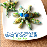 A white plate presents underwater octopus Rice Krispie treats, adorned with blue and green sprinkles and candy eyes. The image includes a website link at the bottom: www.3BoysandaDog.com.