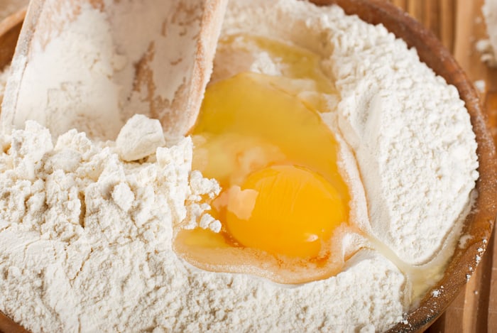 Flour with raw egg for making dough