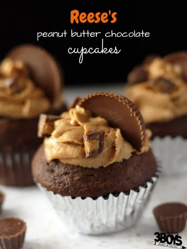 Reese's Peanut Butter Chocolate Cupcakes - the perfect excuse to stock up on Hallowe'en candy! The best chocolate cake with a rich peanut butter frosting and chocolate peanut butter center topped with cute mini Reese's peanut butter cups - yum.