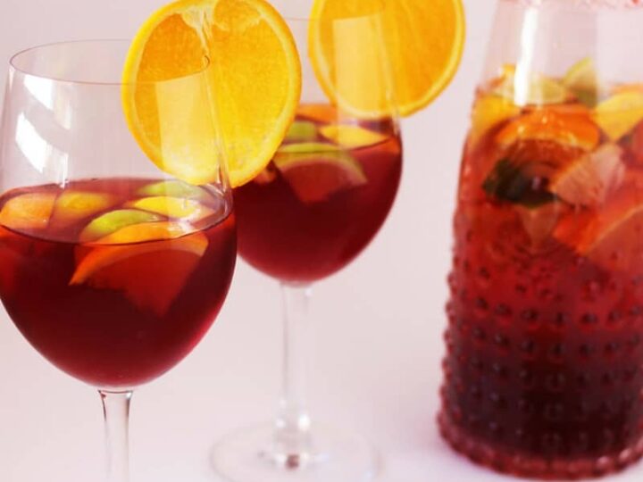 This Virgin Sangria Mocktail Recipe is a fun and festive option that is super quick to whip together right before your guests arrive, or even with them helping!