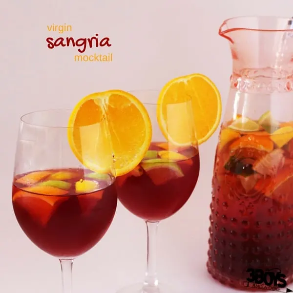 Virgin Sangria Mocktail Recipe - the perfect nonalcoholic beverage for your holiday get-together. This citrus-cranberry twist is perfect for the holidays, too
