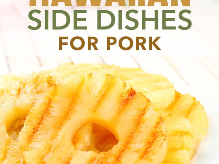 Grilled pineapple rings elegantly arranged on a white plate, resting on a light wooden table. A lush green plant provides a tropical backdrop, showcasing the perfect pairing of Hawaiian side dishes for pork.