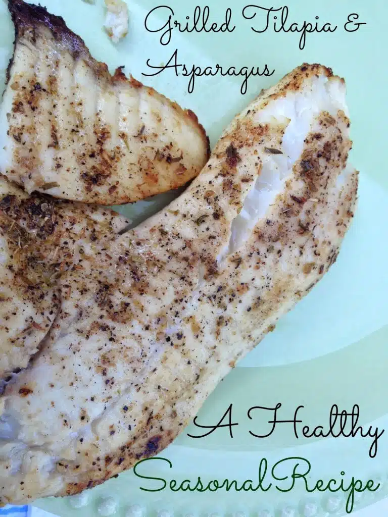 Grilled tilapia fillets seasoned with herbs and spices on a light green plate. The text reads Healthy Tilapia Recipes: Grilled Tilapia & Asparagus - A Seasonal Delight.