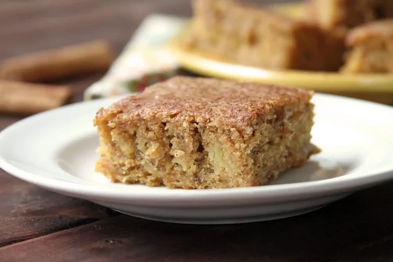 A square of cinnamon spice spaghetti squash cake on a white plate