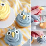 Two owl-themed cupcakes adorned with blue frosting and candy eyes come to life as a hand demonstrates how to make Owl Cupcakes. One boasts yellow beak details, while fondant beaks are shaped and piped onto the cupcakes. Underneath, a striped cloth adds charm.