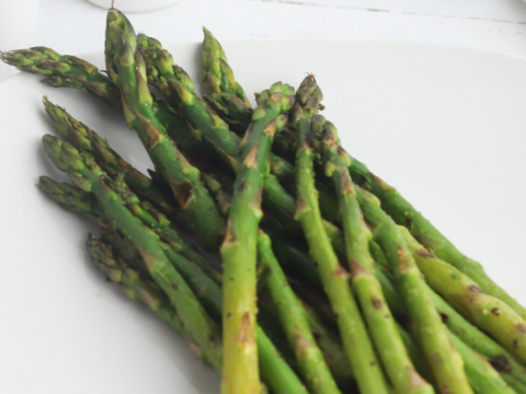 fresh asparagus spears grilled on an indoor grill