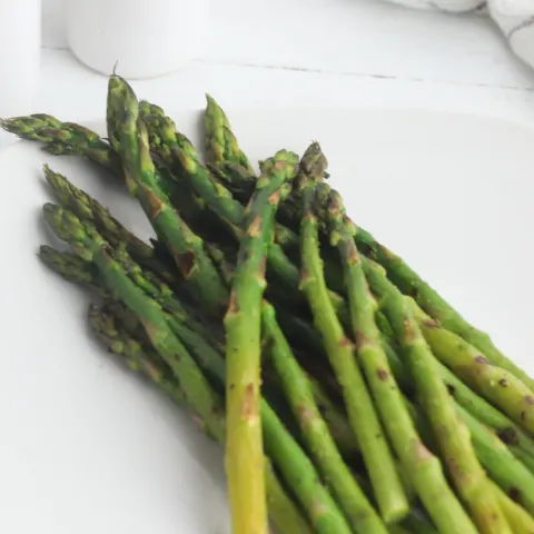 fresh asparagus spears grilled on an indoor grill