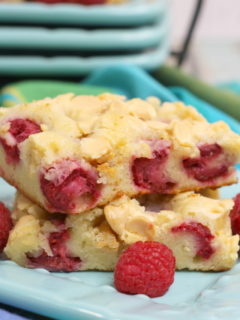 cropped-white-chocolate-and-tart-raspberries-in-a-delicious-cookie-or-blondie-recipe.png