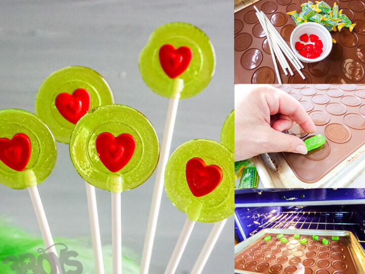 Grinch-themed lollipops made with green candy melts and red heart sprinkles, displayed on a white surface.