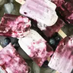pin image that reads cool treat easy dessert with a sheet pan of blueberry popsicles