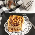 pin image that reads cinnamon rolls easy breakfast with a plate full of a big cinnamon roll