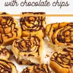 pin image that reads cinnamon rolls with chocolate chips and a cake plate full of baked cinnamon rolls