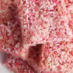 plate of pink rice krispie treats cut into squares
