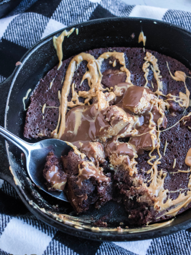 skillet cookie with a spoon taking out a scoop
