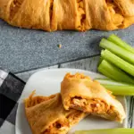 chicken bake easy recipe with sliced baked chicken ring on plate with carrots and celery sticks