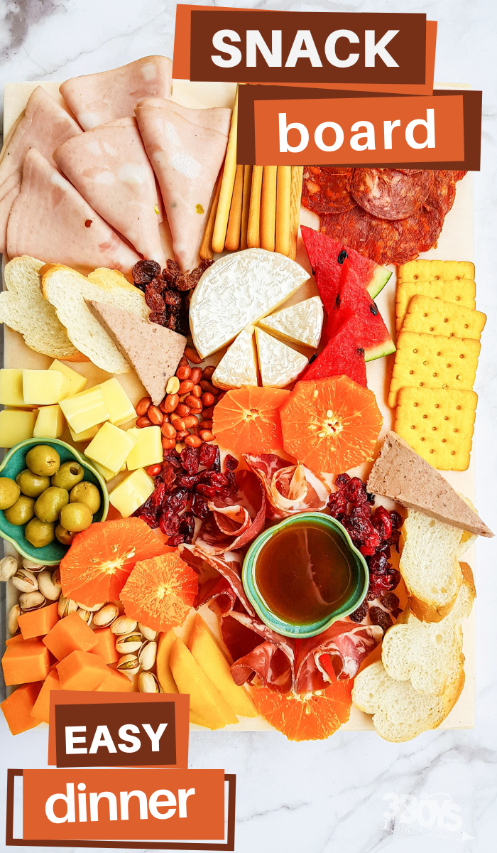 pin image that reads snack board easy dinner with a simple charcuterie board full of toppings and ingredients