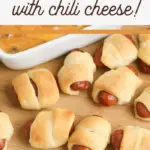 pin image that reads pigs in a blanket with chili cheese on a cutting board