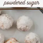 pin image that reads homemade donut holes powdered sugar with fried donut holes on the table