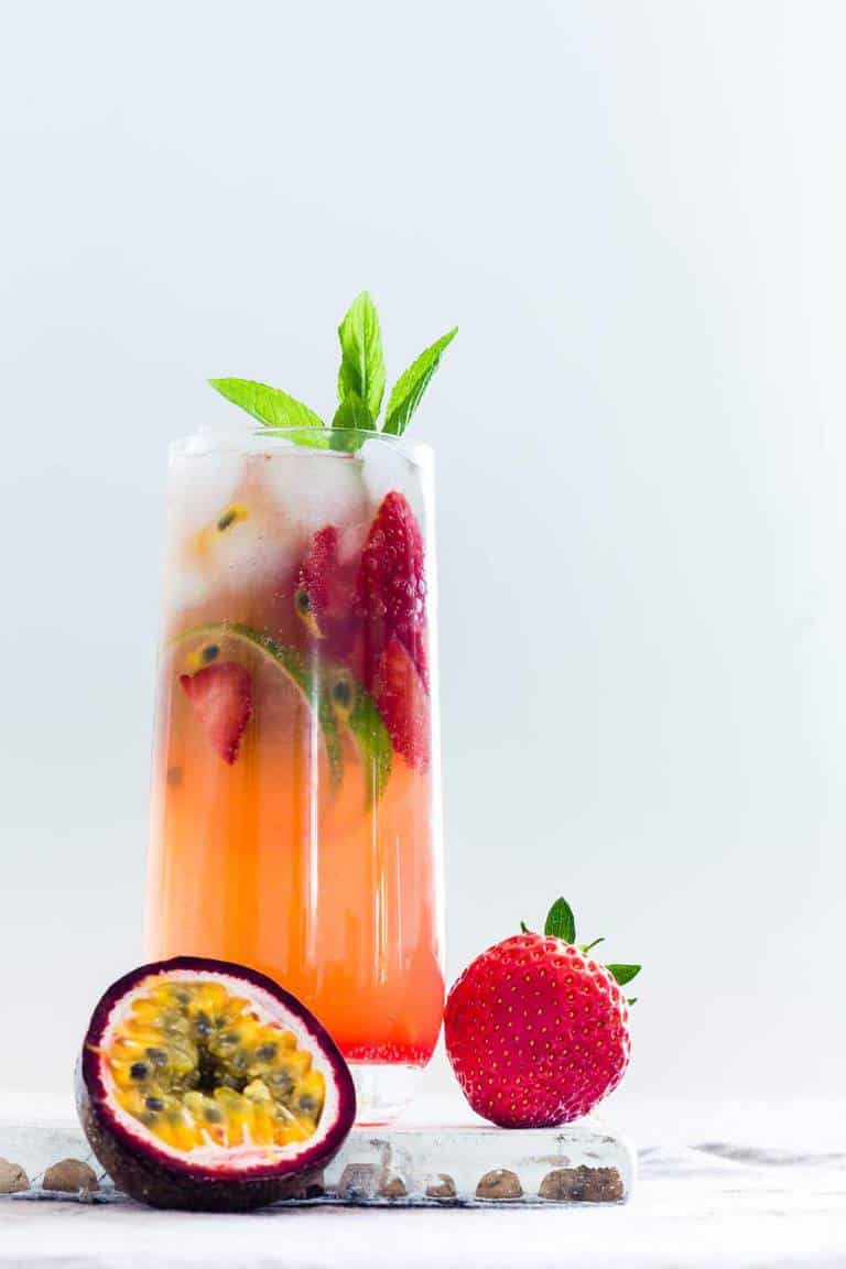 Ginger beer hibiscus mocktail with strawberries and lime