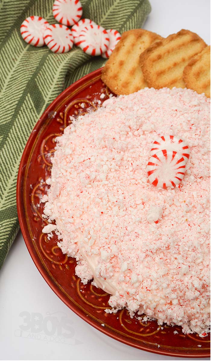 overhead view of a peppermint cheese ball served with cookies