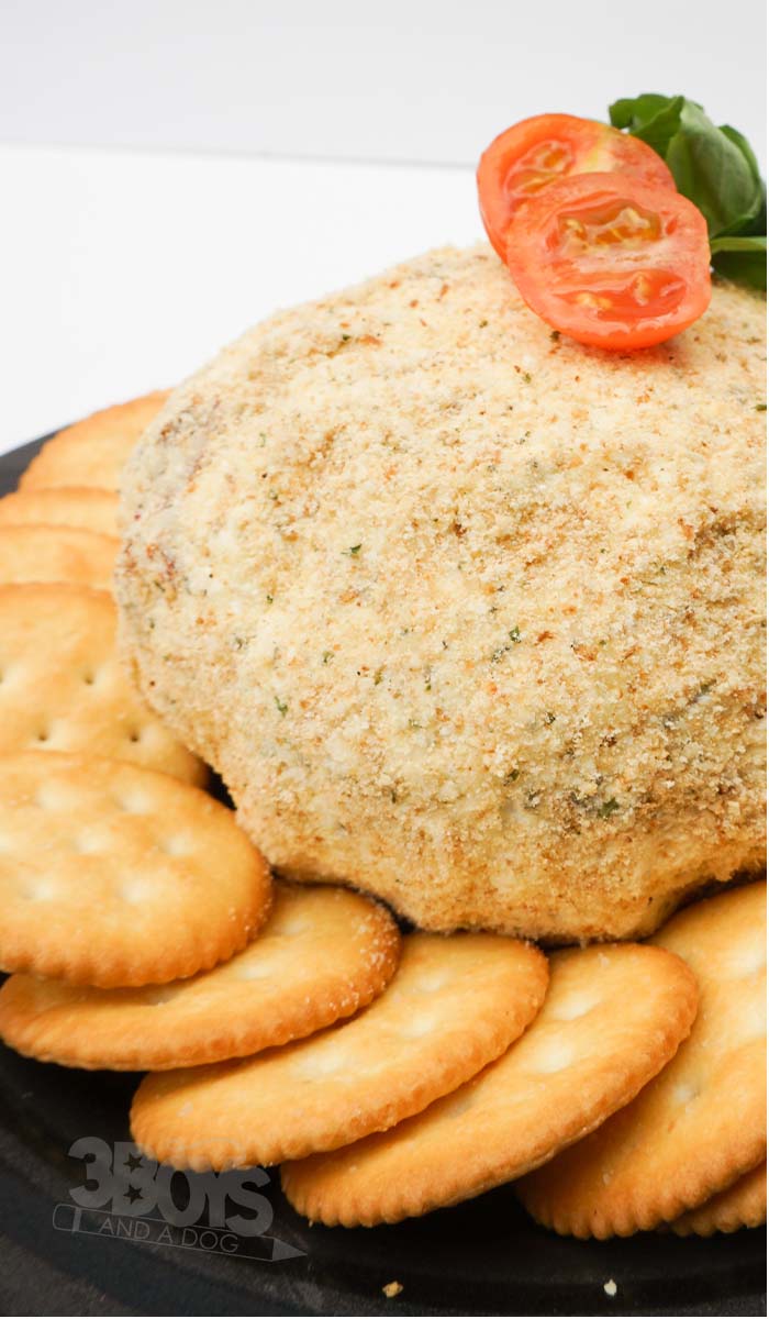 sun-dried tomato and basil cheese ball served with crackers
