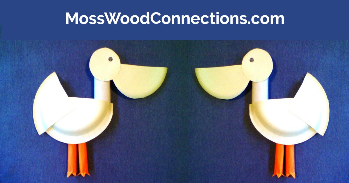 Two paper plate pelican crafts with large beaks and orange legs are displayed on a blue background. The text MossWoodConnections.com is written at the top.