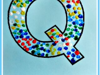 A large letter Q is filled with colorful paint dots made using Q-tips. Below it, text reads: Q is for Q-Tip and Quilt. The background is light blue with a white border.