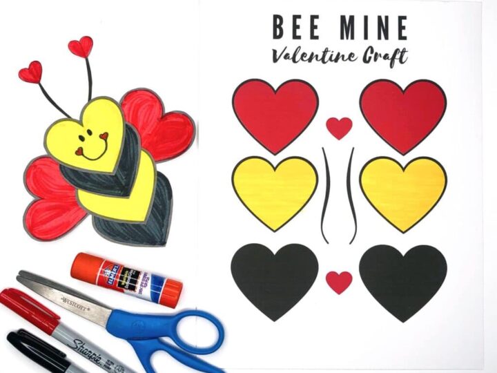 Printable craft set for a Bee Mine Valentine theme, featuring cutouts of red, yellow, and black hearts. Includes a completed bee craft, scissors, glue stick, and markers.