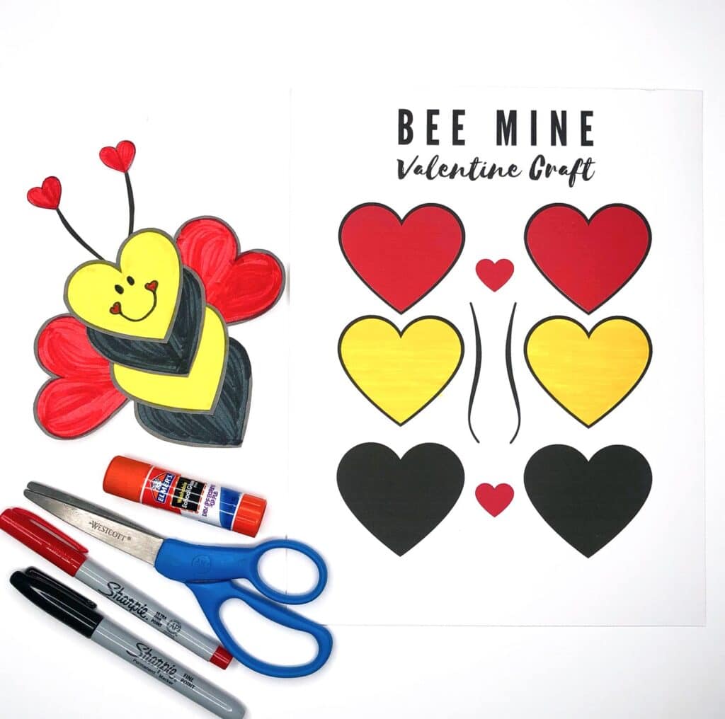 Printable craft set for a Bee Mine Valentine theme, featuring cutouts of red, yellow, and black hearts. Includes a completed bee craft, scissors, glue stick, and markers.