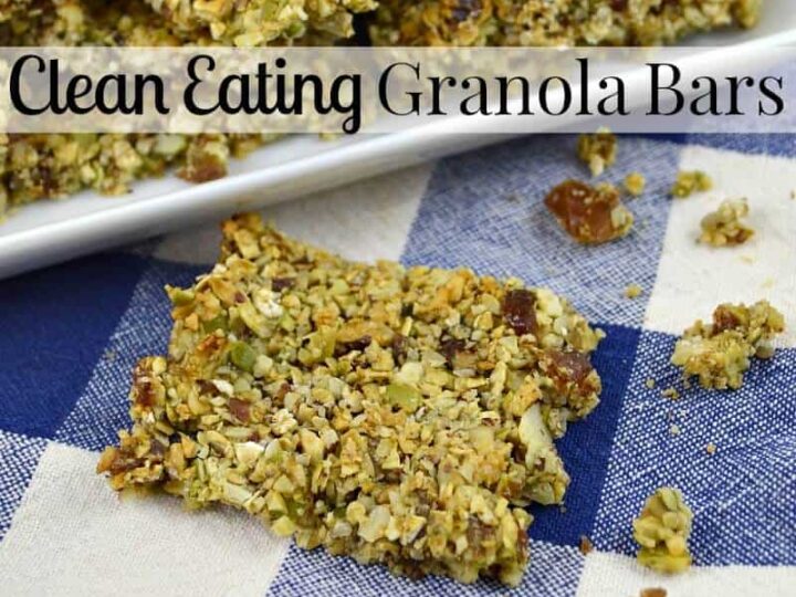 Granola bars on a checkered blue and white cloth. Text reads Clean Eating Granola Bars. Crumbs are scattered around the bars.