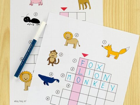 A crossword puzzle worksheet featuring animals like a lion, monkey, and fox. The top of the image has a title saying Crossword Puzzles: 3 Simple Picture Puzzles. The sheet shows partially completed grids with animal illustrations.