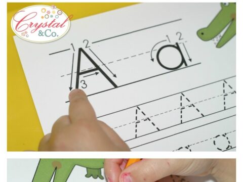 A childs hands practice handwriting with uppercase and lowercase A on a worksheet. The page includes alligator illustrations and step-by-step writing guides. Text at the top says handwriting practice for kids: a is for alligator.