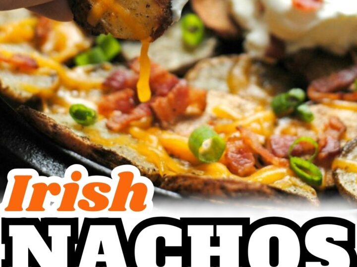 A hand picking up a loaded Irish nacho from a dish topped with melted cheddar cheese, bacon, green onions, sour cream, tomato, and jalapeno slices. Text below lists ingredients: large russet potatoes, olive oil, garlic, salt and pepper, cheddar cheese.