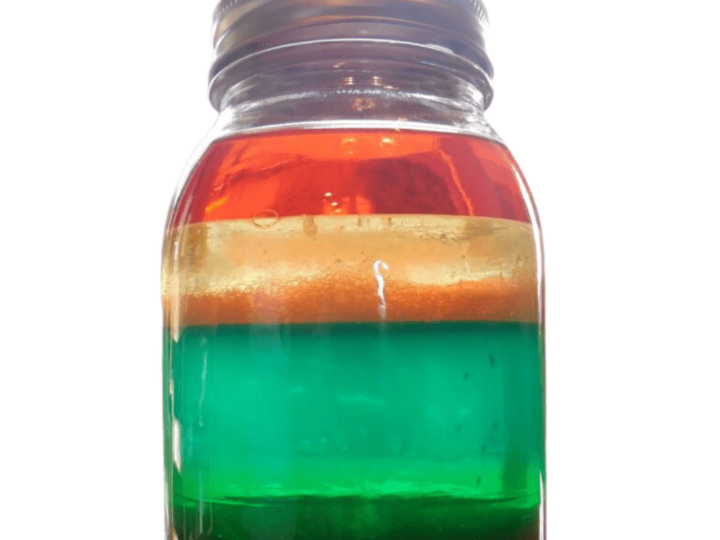 A clear mason jar filled with layered liquids in red, orange, yellow, green, blue, and purple, creating a rainbow effect. The jar is against a white background. The text on the image reads Rainbow Jar: Kids Science Experiment.