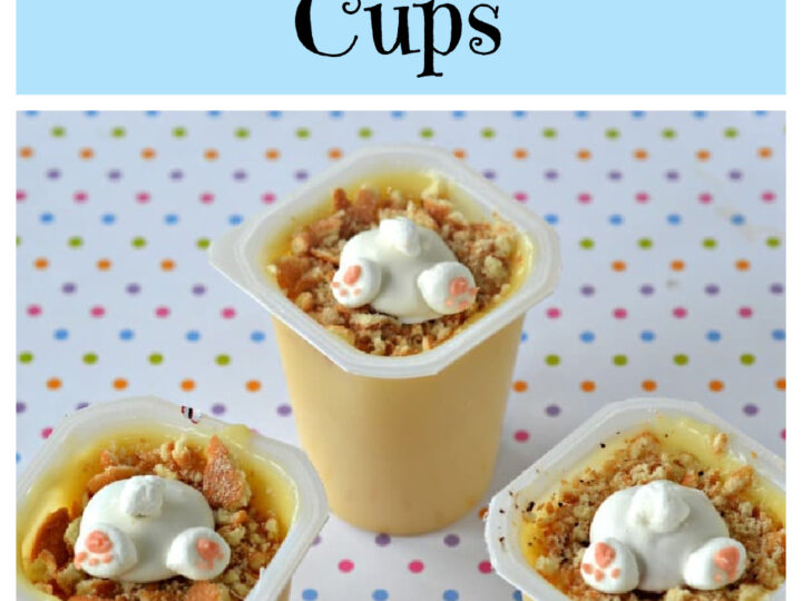 Three pudding cups topped with white chocolate bunny shapes and crumbs are on a polka-dotted table. The text above reads Easter Bunny Butt Pudding Cups.
