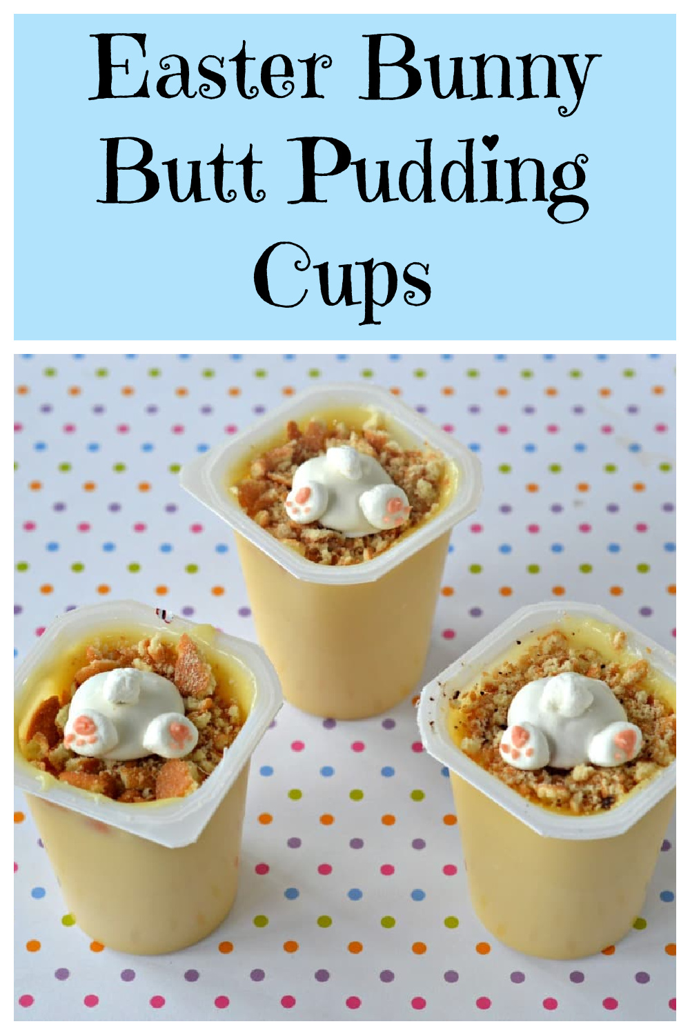Three pudding cups topped with white chocolate bunny shapes and crumbs are on a polka-dotted table. The text above reads Easter Bunny Butt Pudding Cups.