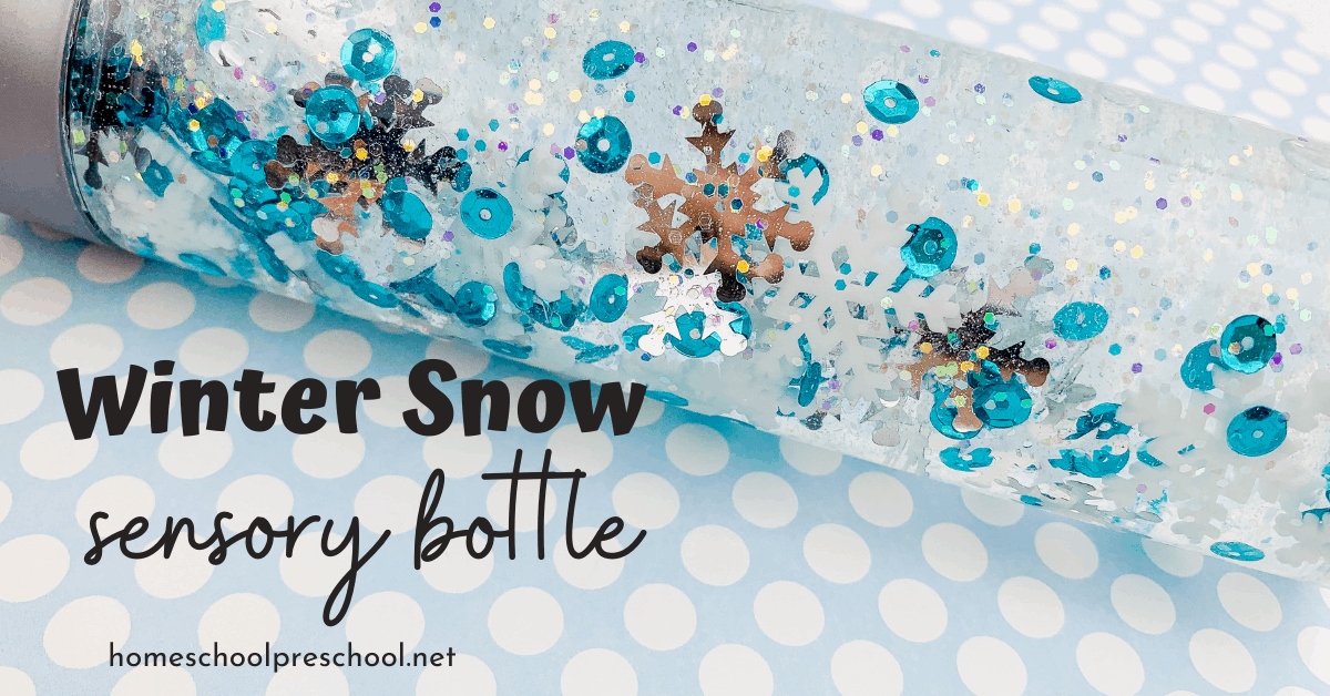 A clear sensory bottle filled with water, blue sequins, silver snowflakes, and glitter. The words Winter Snow sensory bottle are written on the image. The background is a white polka dot pattern on a light blue surface.