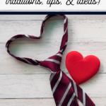 A striped necktie shaped like a heart sits beside a red heart on a white wooden surface. Text above reads: Father’s Day traditions, activities, tips, & ideas—perfect inspiration for your Father’s Day celebration!.