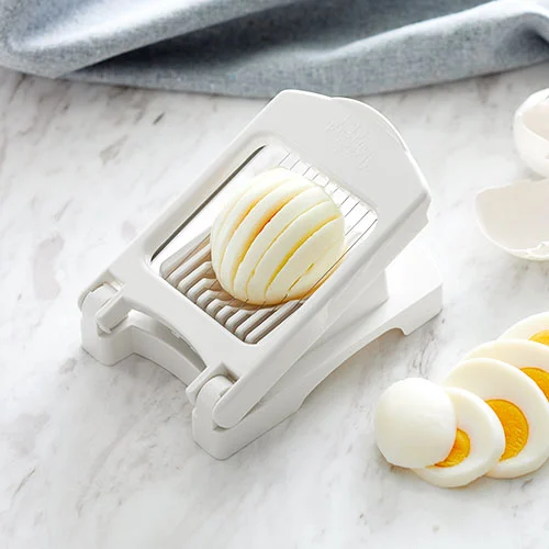 Pampered Chef Egg Slicer Plus slicing a hard-boiled egg