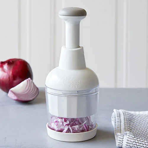 Pampered Chef Food Chopper filled with chopped red onion