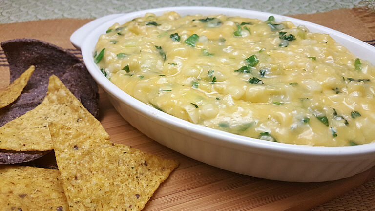 Easy cheesy warm corn dip with tortilla chips