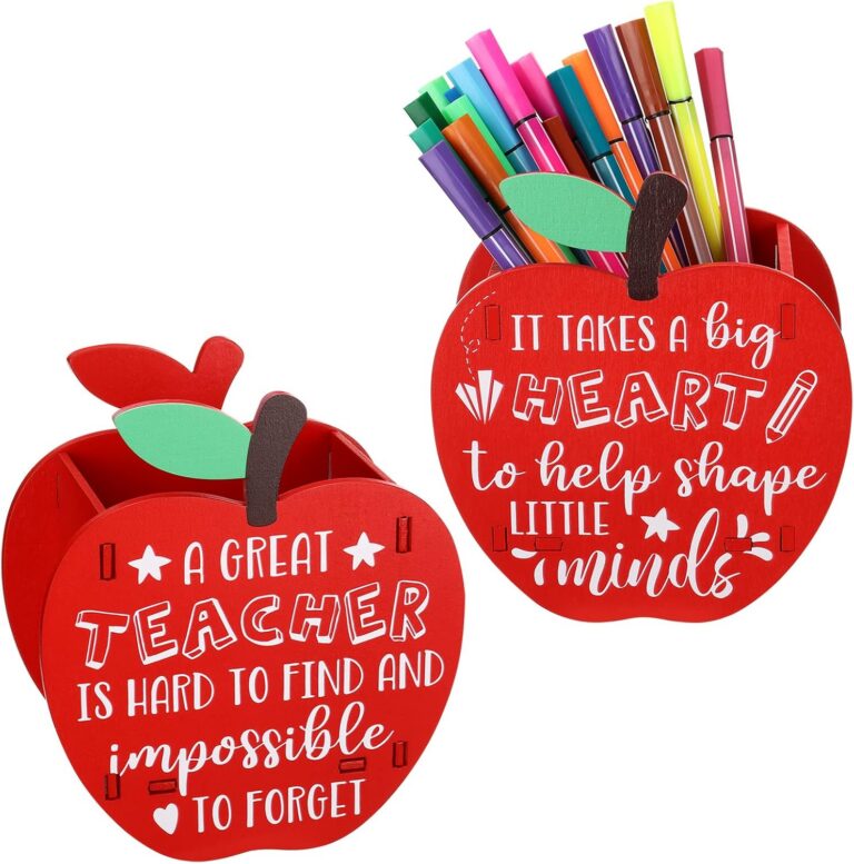 Two red wooden apple-shaped pencil holders for a teacher desk