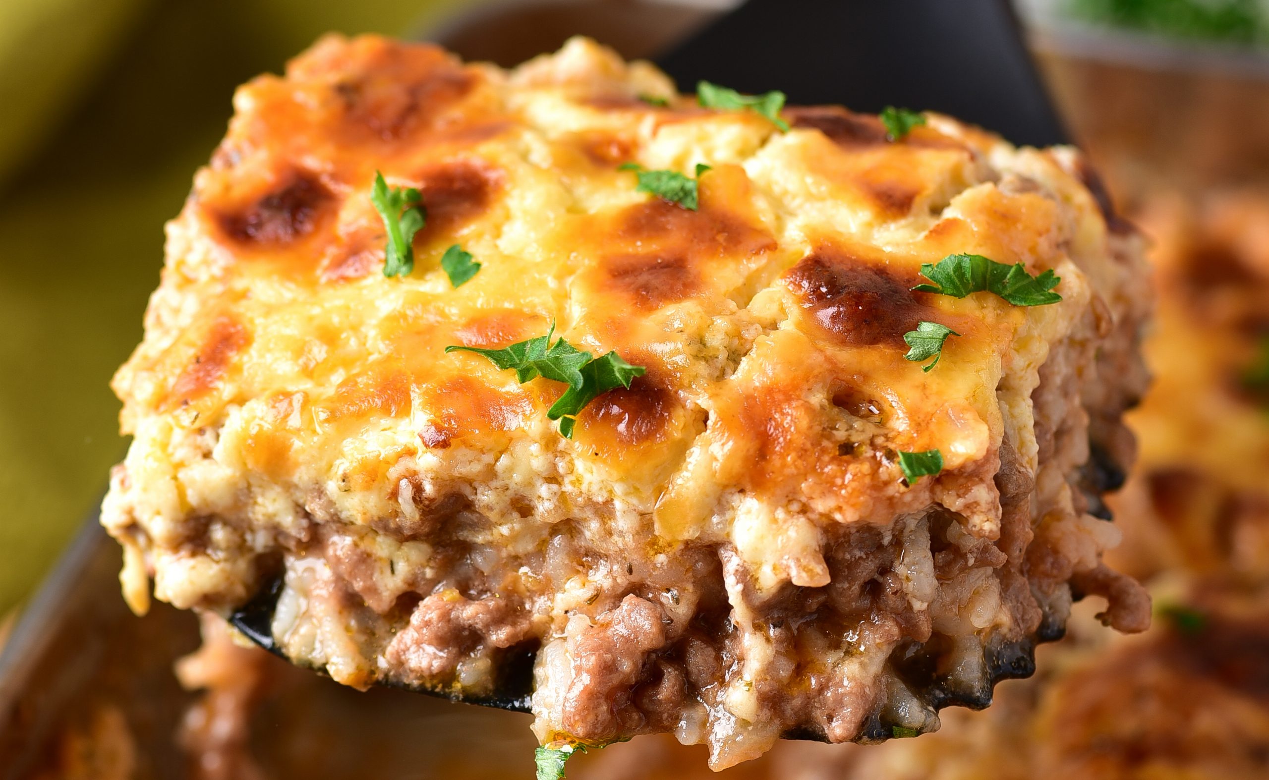 Cheesy ground beef rice casserole in a baking dish