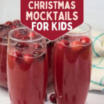 Glasses of red Cranberry Kiss mocktail with fresh cranberries under the text Easy and Fun 17 Festive Christmas Mocktails for Kids