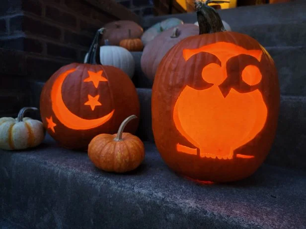 Glowing carved jack-o-lanterns made with easy pumpkin carving stencils